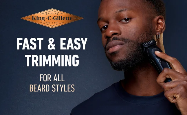 A man is trimming his beard with King C. Gillette Trimmer for all beard types.