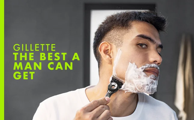 Man shaving his face with a Gillette razor, accompanied by the tagline