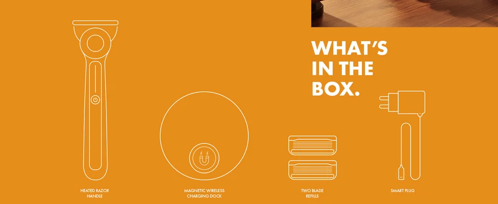 WHAT’S IN THE BOX HEATED RAZOR HANDLE MAGNETIC WIRELESS CHARGING DOCK TWO BLADE REFILLS SMART PLUG