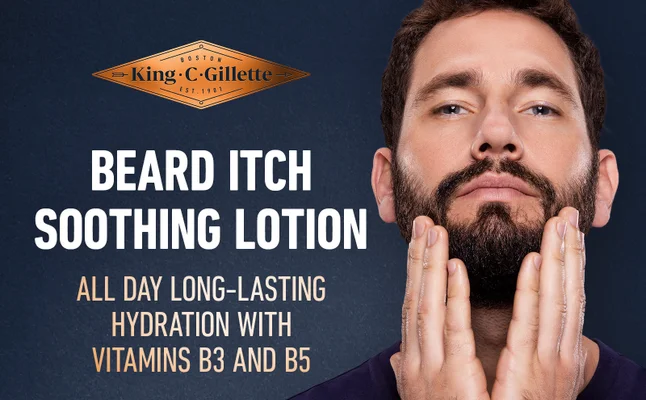 A man is touching his beard after using King C. Gillette Beard Itch Soothing Lotion.