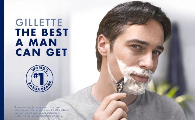Man shaves his right cheek. Text reads 'Gillette. The best a man can get.'
