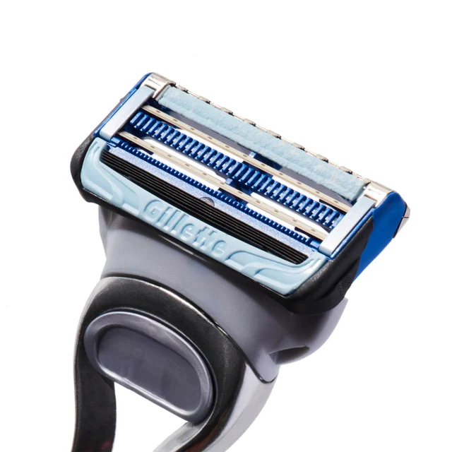 Gillette razor head with multi-blade system and lubricating strip.