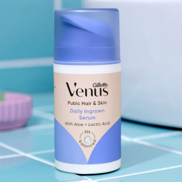 A close-up shot of Gillette Venus Intimate Daily Ingrown Serum, positioned against a blue tiled backdrop, showcasing its packaging and product details.