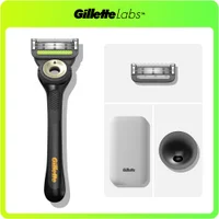 GilletteLabs razor, shown with an extra blade, travel case, and charging stand.