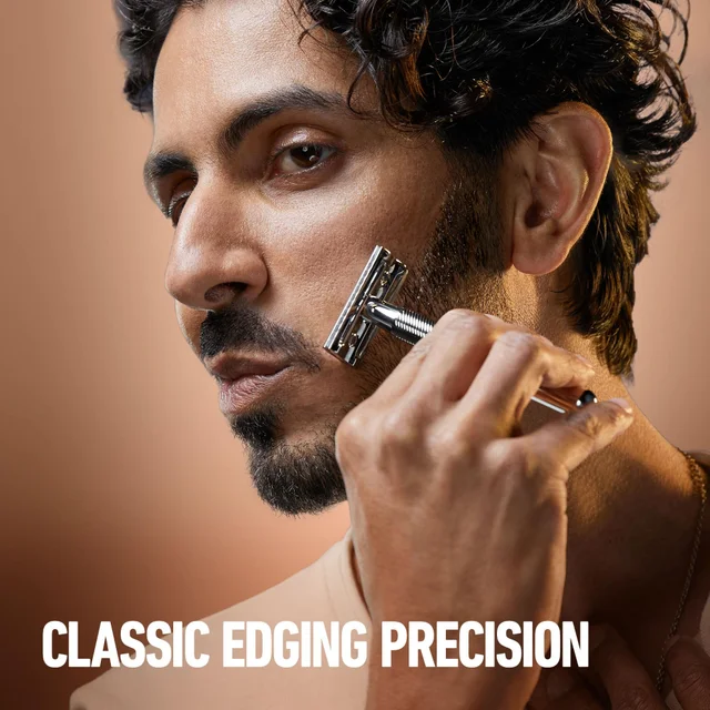 Man uses the King C Gillette double edge razor for classic edging precision.