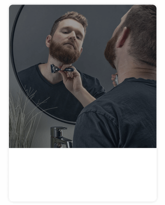 Bearded man shaving neck with King C. Gillette razor | Gillette UK