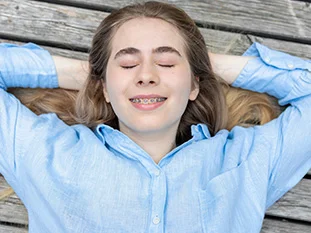 Woman lying down with closed eyes